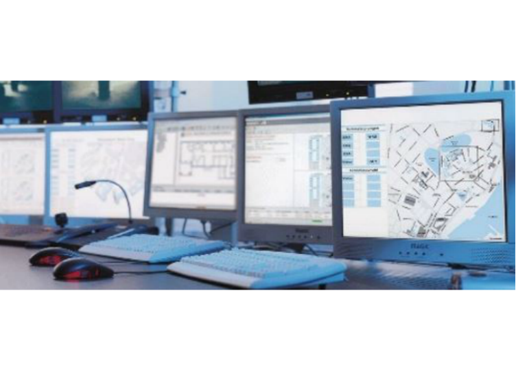 Group of monitors displaying Tyco Integrated Systems Manager data on screen