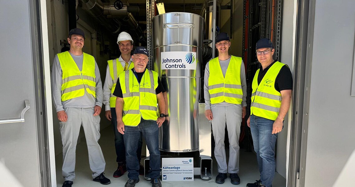 Johnson Controls technicians posing for a picture in an industrial plant