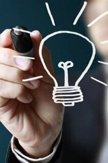 A man drawing a light bulb on a smart screen