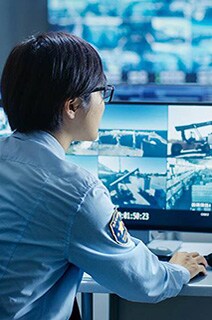 Security officer monitoring cctv footage