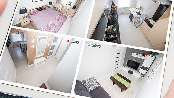 Close-up of a person holding the tab and scanning the cctv fottages