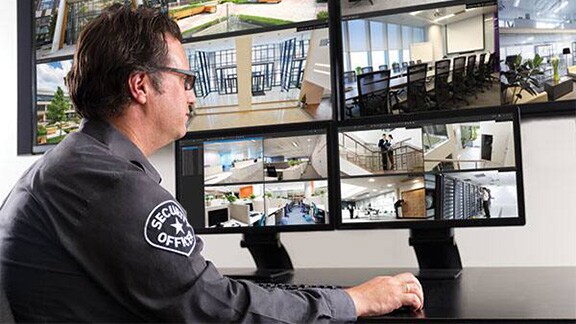 A security person watching the cctv footages