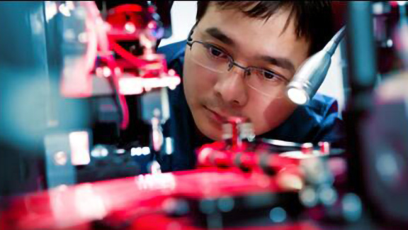 Mechanic working on the motherboard of a machine