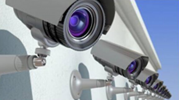 Rows of cctv cameras installed in a building exterior