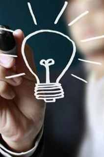 Man using a stylus to draw a light bulb on a smart screen