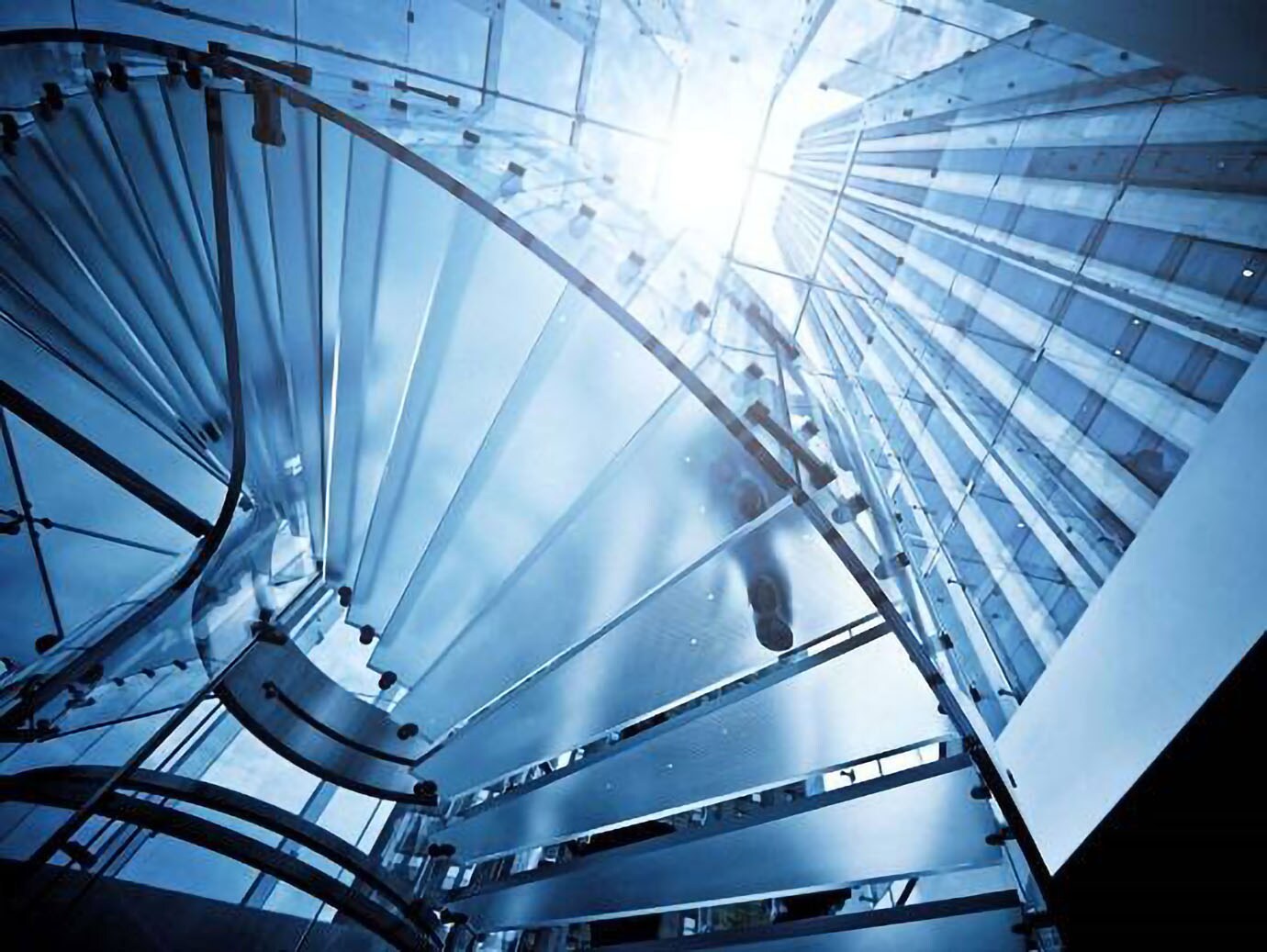 Upwards shot of a glass staircase in a building