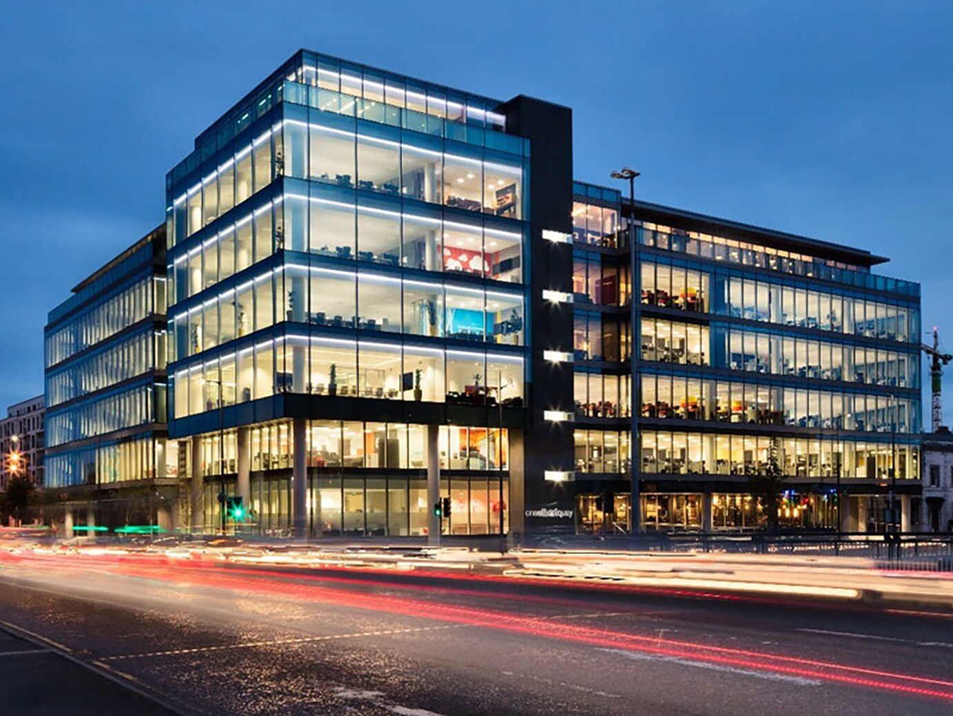 Exterior of a commercial building lit up during night-time