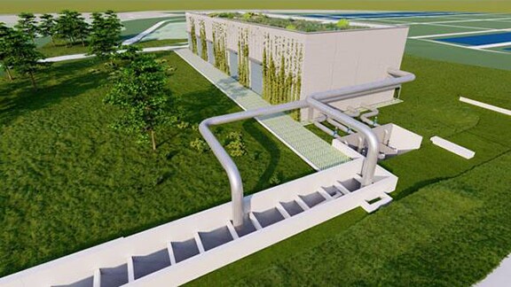 A water tank and pipes in an agricultural setting