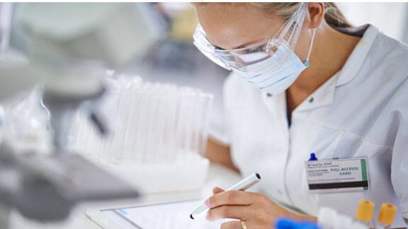 A female doctor inspecting samples in a laboratory