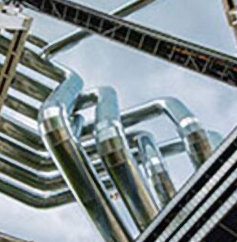 Upwards view of a piping system at a chemical plant