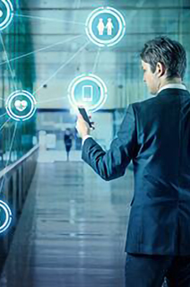 A man in business formals touching a smart screen displaying digital icons