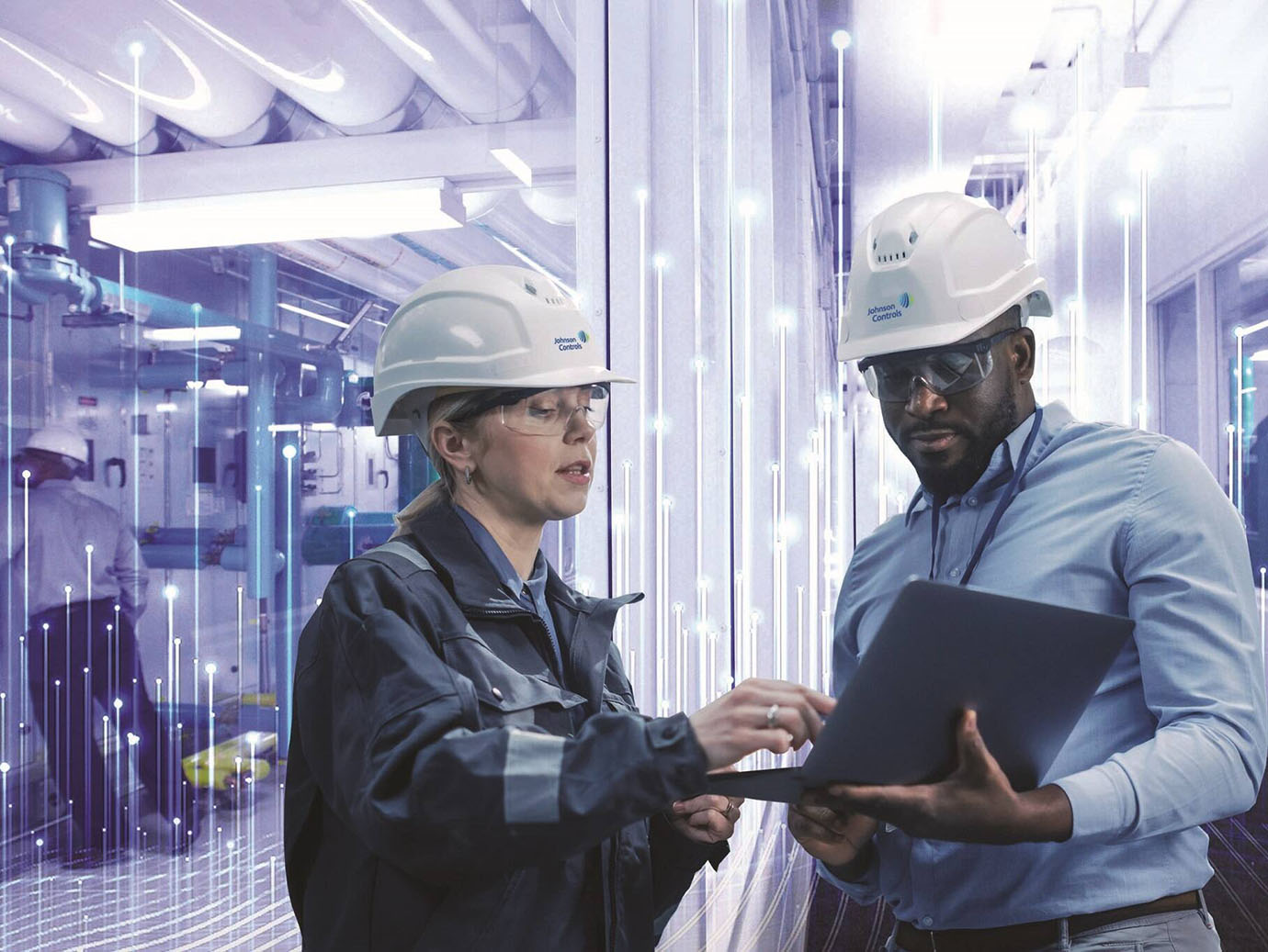 Two engineers in discussion in a boiler room