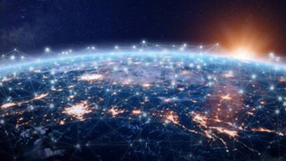 Close-up shot of a globe with graphical communications lines