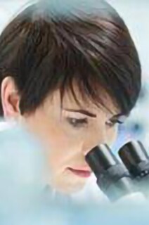 Female pathologist using a microscope in a laboratory