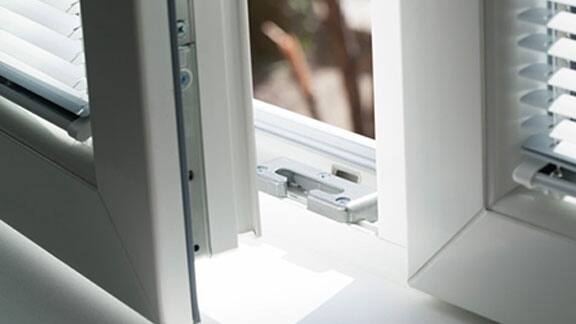 Close-up of a slightly opened glass window