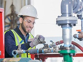 Man is smiling and working